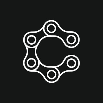Letter C Shaped by White Bicycle Chain Links on a Black Background