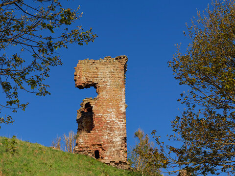 The ruins of the Rectangular Sandstone Tower of Red Castle at Lunan Bay overlooking the Beach from the Small hill above Lunan Water.