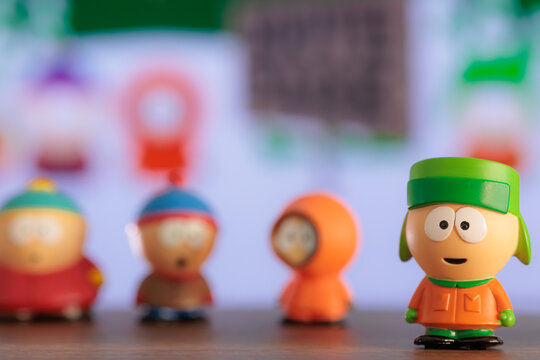 ISTANBUL, Turkiye - MAY 9 2026: South park cartoon characters: Kenny, Eric, Stan, Kyle as toy figures on the background of the TV screen