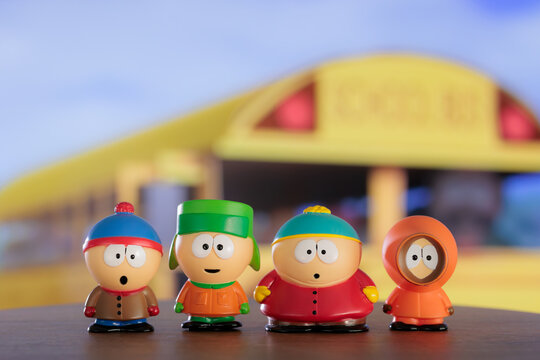 ISTANBUL, Turkiye - MAY 9 2026: South park cartoon characters: Kenny, Eric, Stan, Kyle as toy figures on the background of the TV screen