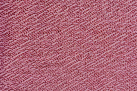Pink loopback sweatshirt knit fabric reverse side texture close up