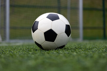 Fototapeta premium Soccer ball on soccer field