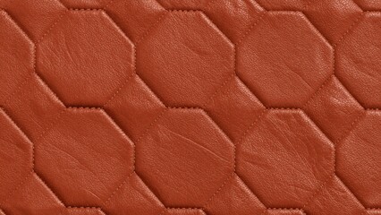 Naklejka premium Close-up of rich brown leather with a quilted hexagonal pattern