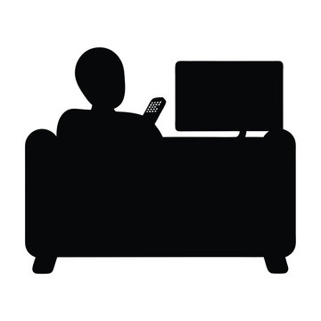 Silhouette of person watching television on a couch with remote control