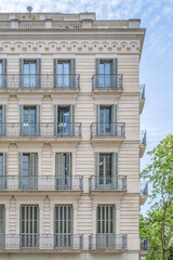 Fototapeta premium Apartment Building Facade in Barcelona with Balconies, Classic Traditional, Spain, Eixample District