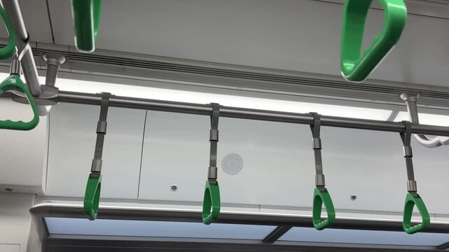 Green handrails for holding onto electric trains. 