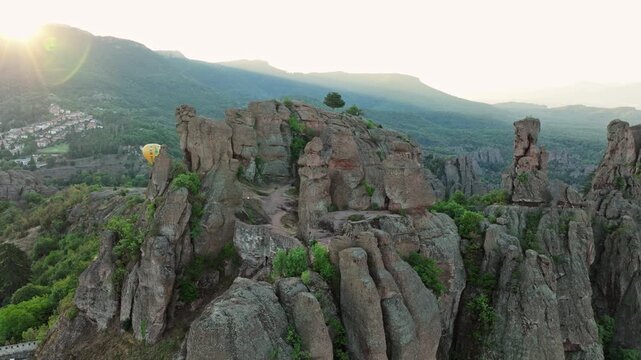 Scenic aerial view Belogradchik Rocks Bulgaria sunrise golden hour lighting mountain panorama summer tourism destination unique rock formations drone shot.