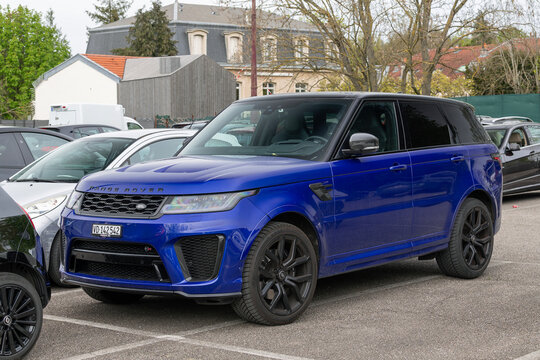 Nancy, France - April 10th 2026 : View on a blue Land Rover Range Rover Sport SVR parked on a parking lot with cars around.