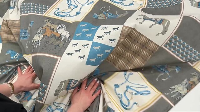 Premium textile featuring artistic horse sketches plaid textures and equestrian gear motifs in a sophisticated palette of blue grey and white tones perfect for bespoke interior design projects