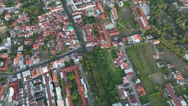 High Angle Aerial View of Densely Populated Residential Area with Red Roofs in Indonesia