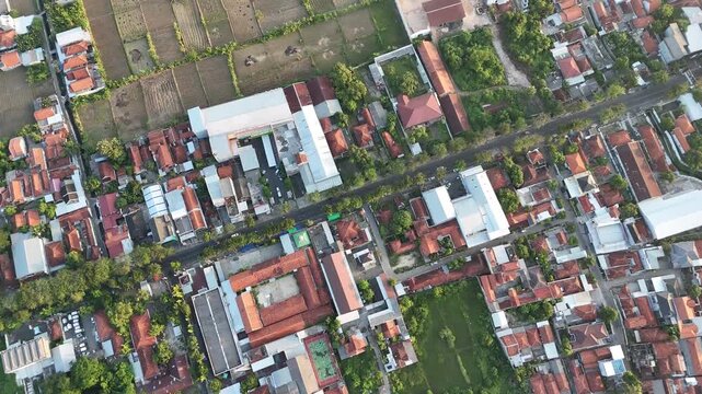 High Angle Aerial View of Densely Populated Residential Area with Red Roofs in Indonesia