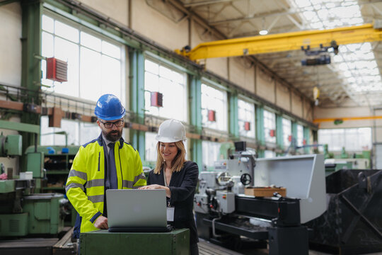 Engineering managers doing routine check up in industrial factory.