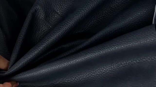The premium navy blue faux leather features a realistic pebble grain texture and a soft matte finish. This durable synthetic material is perfect for upholstery automotive interiors and crafts.