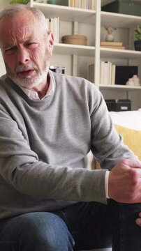 Elderly man suffering from severe knee pain