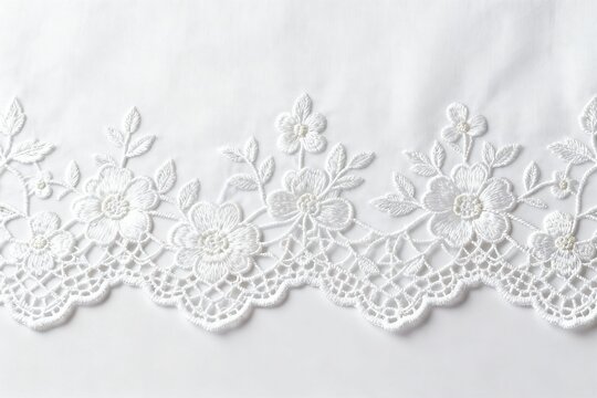 White floral lace embroidery on fabric