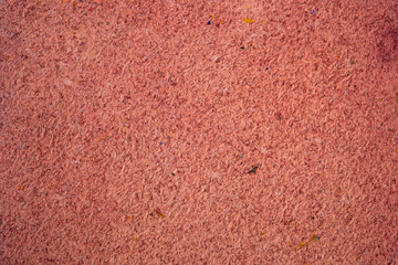 Fototapeta premium Close up of soft pink leather texture background with visible fibers and imperfections