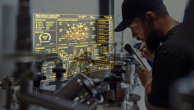 Brewer analyzing beer quality data on tablet with glowing industrial analytics interface. Concept of laboratory testing, beverage inspection, digital diagnostics and quality assurance in brewing.