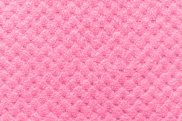 Pink knitted fabric with textured pattern © reddish