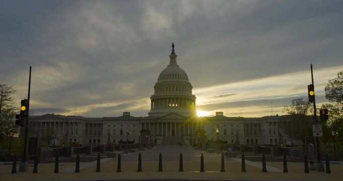 Sunburst Over US Capitol Building at Sunset