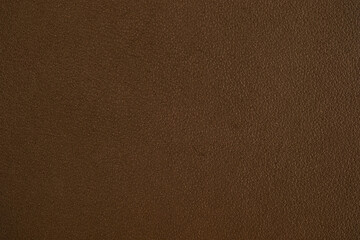 Fototapeta premium Close up of rich brown leather surface with subtle texture for background