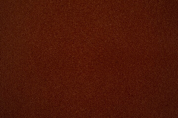 Fototapeta premium Close up of rich brown leather surface texture with subtle detailing for backgrounds
