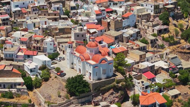 Aerial drone shot of the traditional village Kritsa in Crete featuring a large church