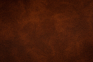 Fototapeta premium Closeup of brown suede texture for background and design Dark brown suede texture with fine detail, perfect for backgrounds and upholstery