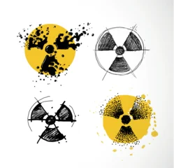 Set of four hand-drawn radioactive symbols in different styles: liquid splash, scribble, sketch and stipple on yellow watercolor. Doodle vector collection for nuclear warning and atomic danger design. © elinacious