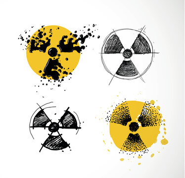 Set of four hand-drawn radioactive symbols in different styles: liquid splash, scribble, sketch and stipple on yellow watercolor. Doodle vector collection for nuclear warning and atomic danger design.