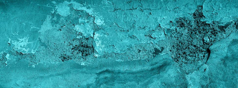 Green cracked wall texture with peeling paint and weathered plaster abstract background