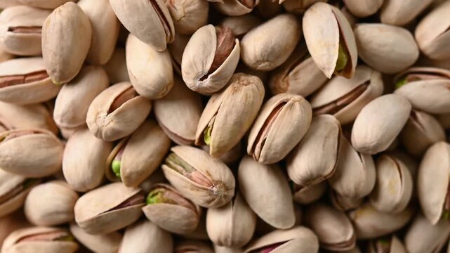 Rotating pistachio background close up texture video