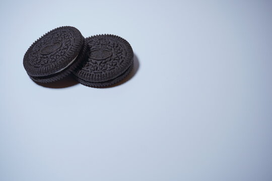two black biscuits stacked on the top left