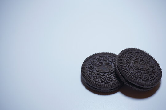 two black biscuits stacked on the bottom right