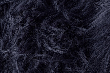 Naklejka premium Dark fluffy faux fur material texture offering a soft deep luxurious and warm background