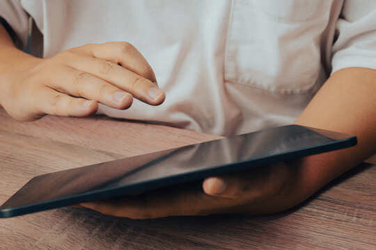 Hands Holding Blank Tablet on Wooden Table Ready to Use, Digital Device Lifestyle Business Concept
