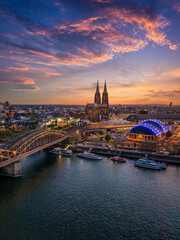 Fototapeta premium Aerial view of the skyline of Cologne, Germany, with river Rhine and famous Cathedral during twilight