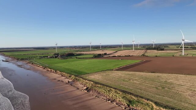 Aerial View of Yorkshire Farmland with Wind Turbines and Tidal River Channel UK