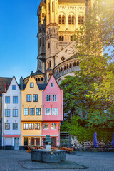 Naklejka premium The cityscape of the old town in Cologne, Germany, in front of the St. Martins Church during sunrise without people