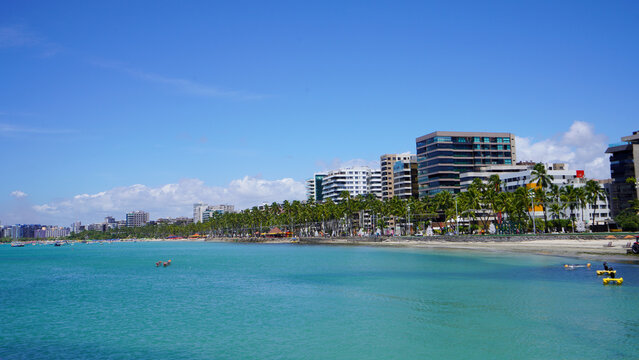 Tropical beach of Ponta Verde with turquoise ocean and waterfront buildings in Maceio, Alagoas, Brazil