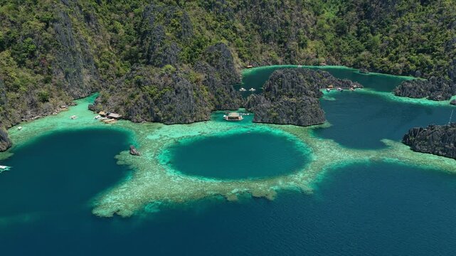 Coron Island Turquoise Blue water and Cliffs Aerial Philiipines