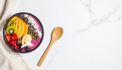 Fototapeta premium Colorful smoothie bowl with fresh fruit on white marble table
