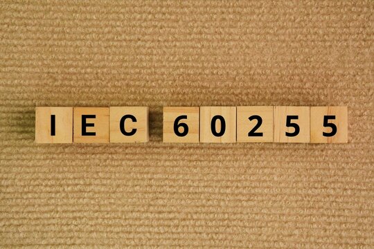 Wooden cube with the words IEC 60255.series is an international standard published by the International Electrotechnical Commission IEC that defines the performance.