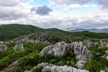 Fototapeta premium Dramatic cloudy sky over the Akiyoshidai karst plateau in Yamaguchi, Japan