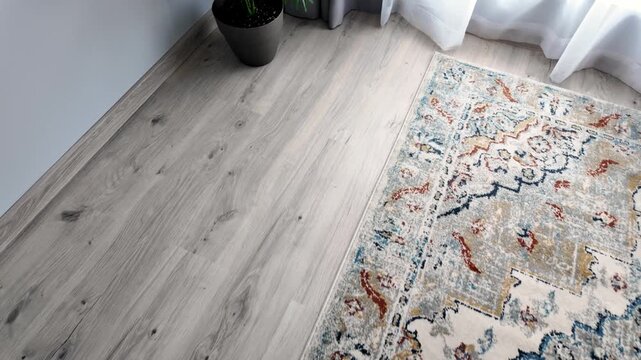 Natural wood laminate parquet floor. Room with floating laminate in new apartmen. Cozy home interior, modern design