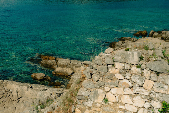 rocky terrain coastal view by the sea at Boka Bay Kotor from Arza Fortress (Fort Arza), located on the Lustica peninsula in Montenegro