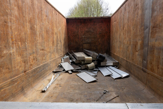 Metal scrap inside industrial waste container