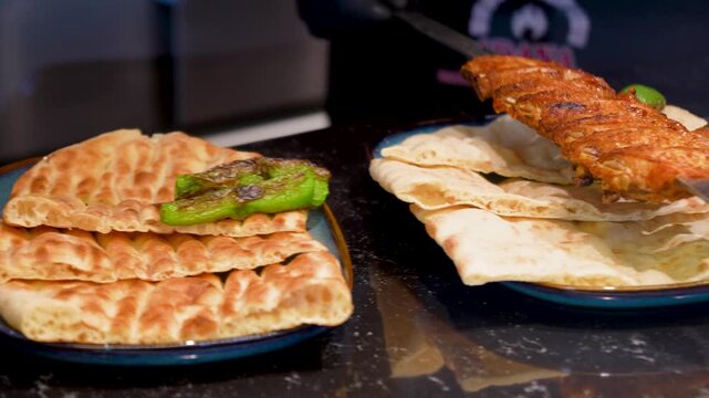 Man making Traditional Turkish pide ramadan pita bread - Ramazan pidesi. Video turkish bread