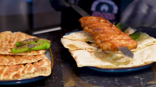 Video Traditional Turkish pide ramadan pita bread served with turkish minced smoked meat - Ramazan pidesi. Video turkish bread