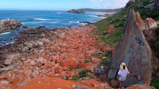 Kids clamber down short via ferrata on scenic Robberg Circular hiking trail