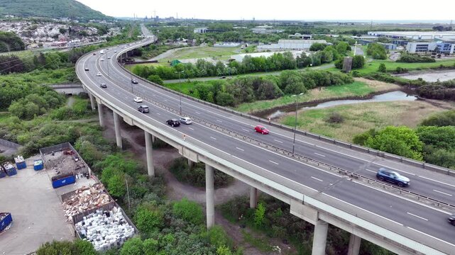 Editorial Neath, UK - May 10, 2026: Traffic on the M4 motorway snaking its way through Briton Ferry heading east towards Port Talbot in South Wales